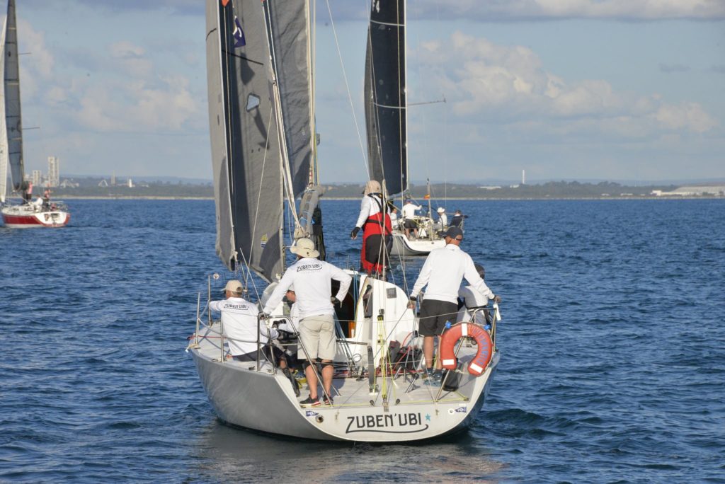 Behind shot of inshore sailors on yacht 'zuben'ubi'