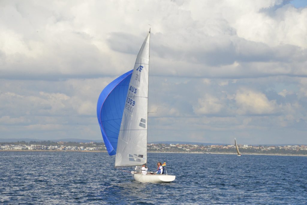 Inshore sailors with blue spinnaker up