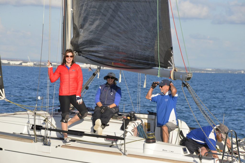 Two women and two men on yacht sailing